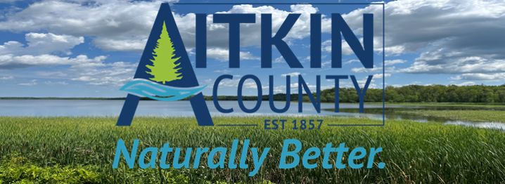 Aitkin County Naturally Better logo over a landscape photo of a lake and green grass and clouds